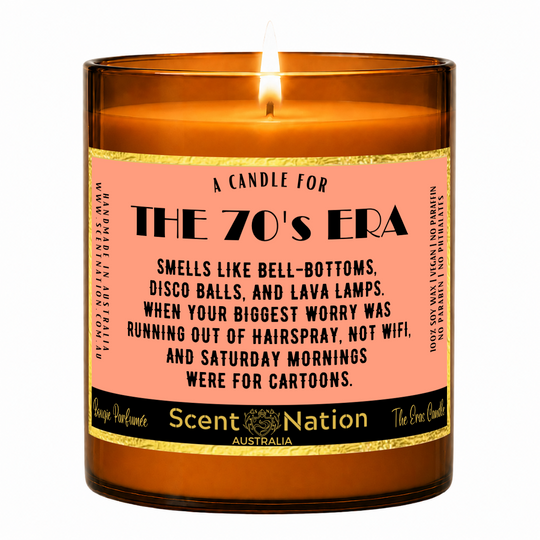 1970s nostalgia gifts – The 70's Era candle: lit Large 285 g soy candle in an amber jar with a gold-trim 'A candle for the 70's era' label, Scent Nation Australia