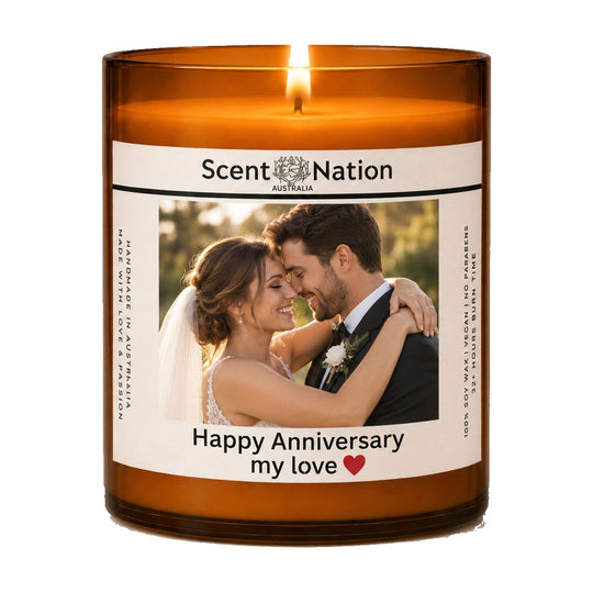 Personalised anniversary gift – Anniversary Photo Candle: lit Large 285 g amber soy candle with a wedding couple photo and 'Happy Anniversary my love' on a white label, Scent Nation Australia