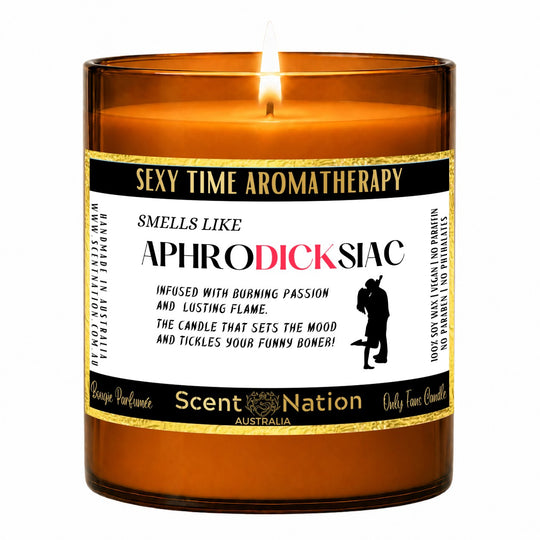 Naughty gift for him – Aphrodicksiac candle: lit Large 285 g amber soy candle with a Sexy Time Aromatherapy label and gold trim, Scent Nation Australia