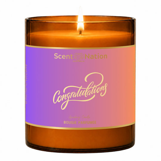 Congratulations gift – Congratulations greeting candle: lit Large 285 g amber soy candle with a lilac-to-coral metallic label and gold-foil Congratulations script, Scent Nation Australia