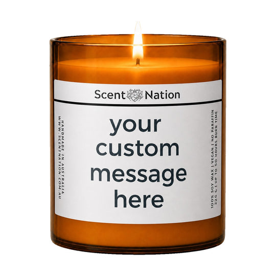 Personalised candle – create your own custom message candle: lit Large 285 g amber soy candle with 'your custom message here' on a white label, Scent Nation Australia