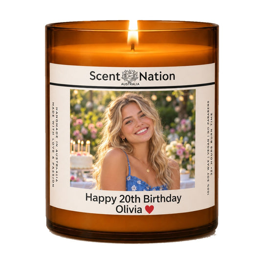 20th birthday gift – Happy 20th Birthday photo candle: lit Large 285 g amber soy candle with her photo and 'Happy 20th Birthday Olivia' on a white label, Scent Nation Australia