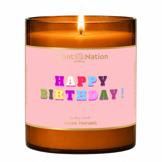 Happy birthday candle gift – lit Large 285 g amber soy candle with a pink metallic label and colourful foil Happy Birthday lettering, Scent Nation Australia