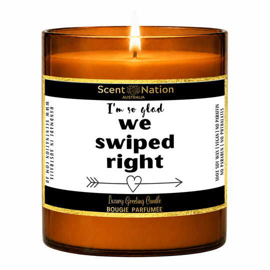 Dating app couple gift – I’m so glad we swiped right candle: lit Large 285 g amber soy candle with a white label and gold trim, Scent Nation Australia