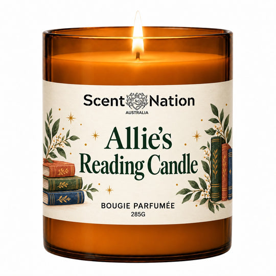 Personalised book lovers gift – personalised reading candle: lit Large 285 g amber soy candle with the name Allie and 'Reading Candle' on a cream label with stacked books and leaves, Scent Nation Australia