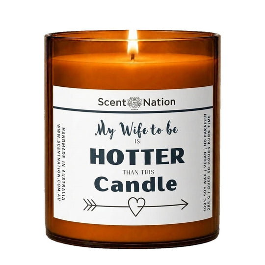Engagement gifts: My Wife to Be Is Hotter Than This Candle, Large 285g amber soy jar with a white label, script and bold lettering and an arrow-and-heart line, Scent Nation Australia