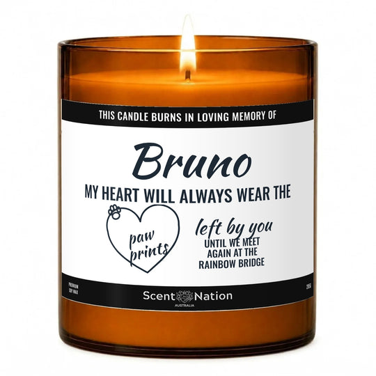 Pet memorial gifts: In Loving Memory pet memorial candle with the name Bruno, Large 285g amber soy jar, white label with a paw-print heart and rainbow bridge words, Scent Nation Australia