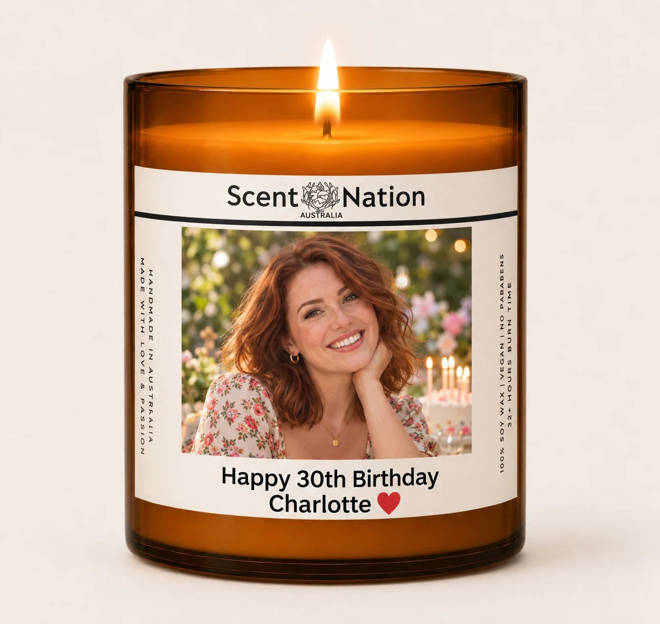 Personalised photo candle Australia – Happy 30th Birthday Charlotte printed under her photo on a lit Large 285g amber soy candle, Scent Nation photo candle gift