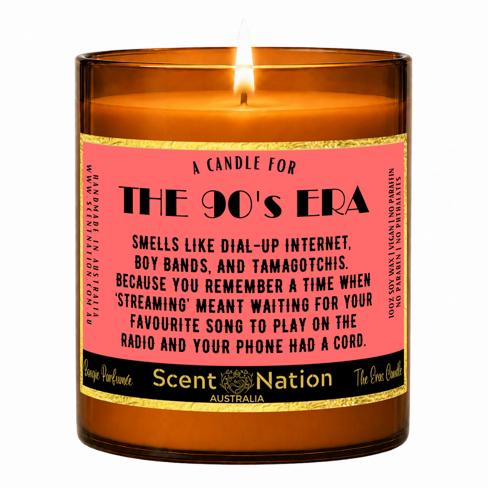90s nostalgia gifts – The 90's Era candle: lit Large 285 g soy candle in an amber jar with a gold-trim 'A candle for the 90's era' label, Scent Nation Australia