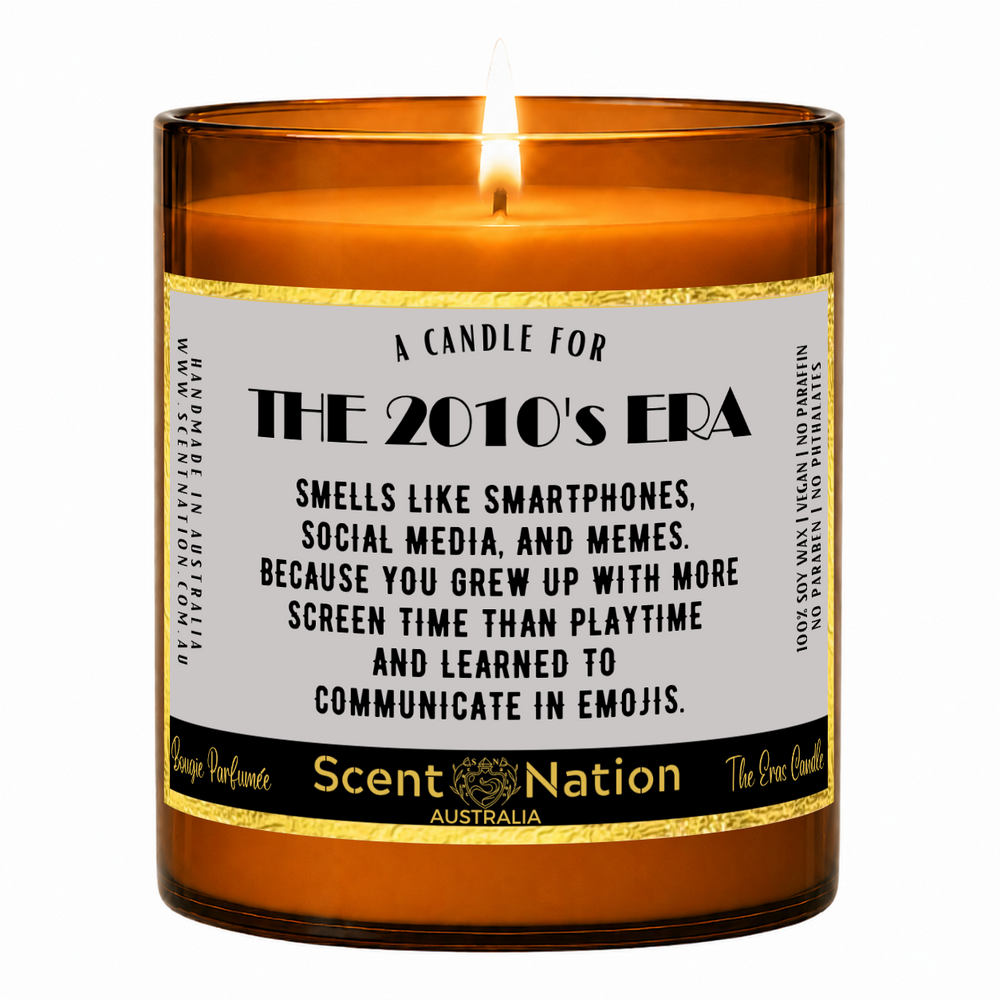 2010s nostalgia gifts – The 2010s Era candle: lit Large 285 g soy candle in an amber jar with a gold-trim 'A candle for the 2010's era' label, Scent Nation Australia
