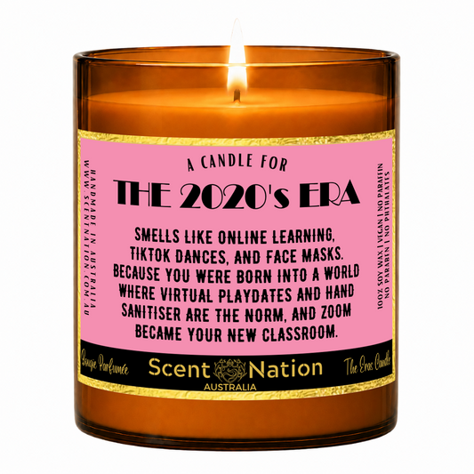Eras candle gift – The 2020s Era candle: lit Large 285 g soy candle in an amber jar with a gold-trim 'A candle for the 2020's era' label, Scent Nation Australia