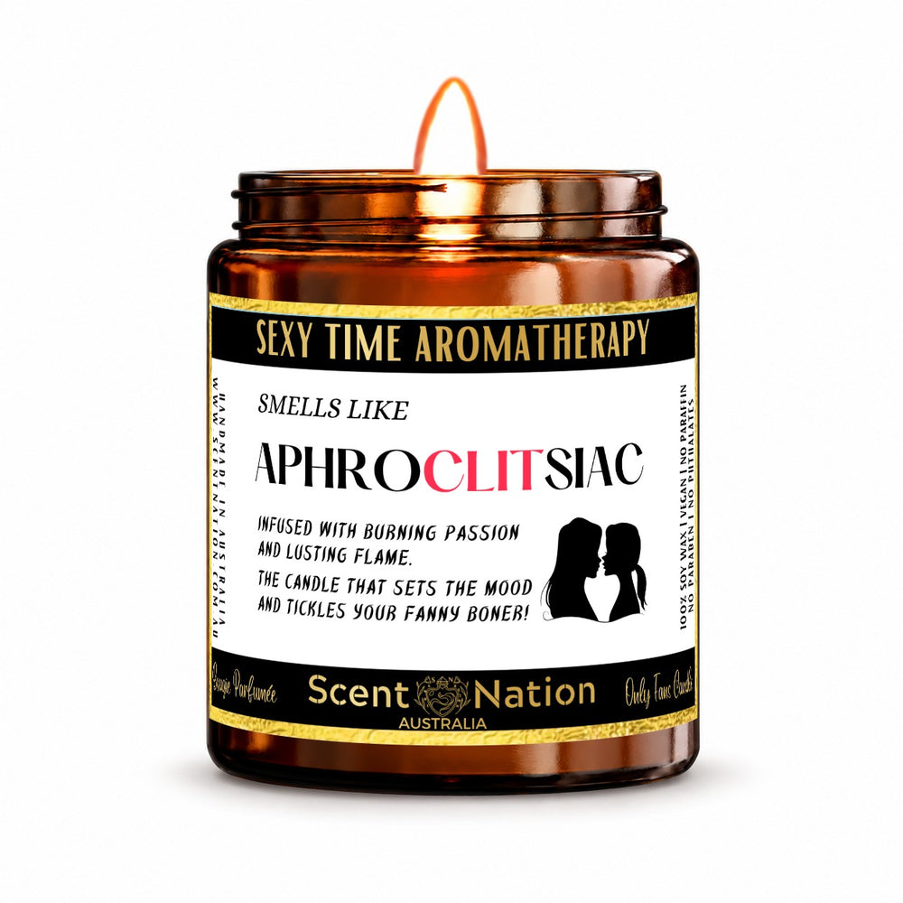 Naughty gift for her – Aphroclitsiac candle: lit Medium 225 g amber soy candle with a Sexy Time Aromatherapy label and gold trim, Scent Nation Australia