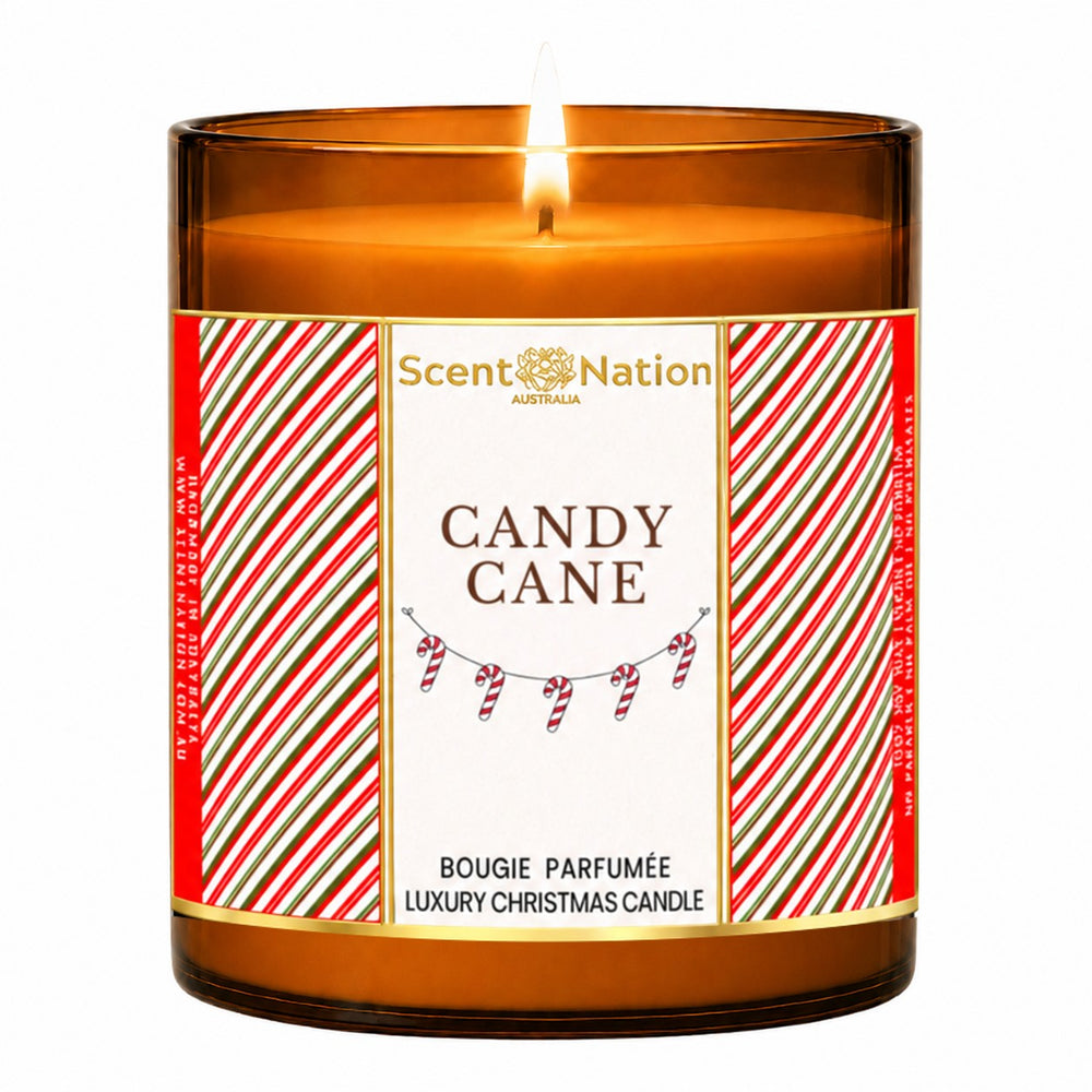 Christmas candle – Candy Cane luxury Christmas candle: lit Large 285 g amber soy candle with a red-and-green candy-stripe label and gold frame, Scent Nation Australia
