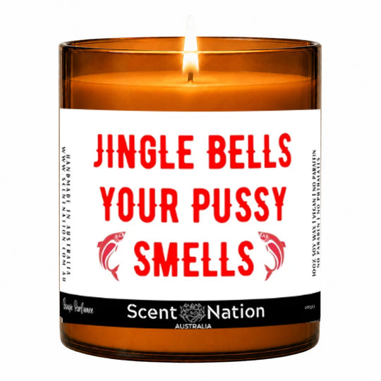 Funny adult Christmas gift – lit Large 285 g amber soy candle with a red Jingle Bells joke label and dolphins, Scent Nation Australia