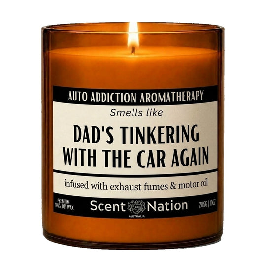 Birthday gift for car lovers: Auto Addiction Aromatherapy candle, Large 285g amber soy jar with a cream and black label reading Smells Like Dad's Tinkering With the Car Again, Scent Nation Australia