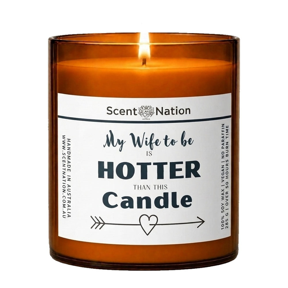 Engagement gifts: My Wife to Be Is Hotter Than This Candle, Large 285g amber soy jar with a white label, script and bold lettering and an arrow-and-heart line, Scent Nation Australia