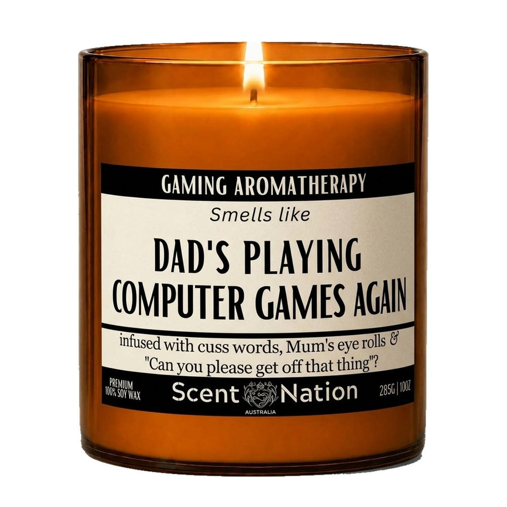 Gifts for gamers: Gaming Aromatherapy candle, Large 285g amber soy jar with a cream and black label reading Smells Like Dad's Playing Computer Games Again, Scent Nation Australia