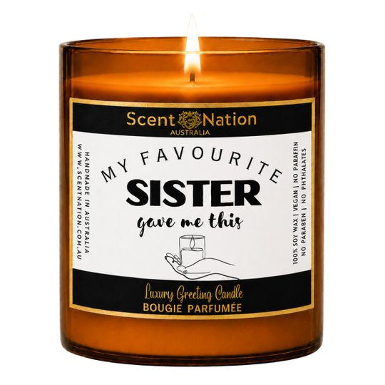 Gifts for sister: My Favourite Sister Gave Me This candle, Large 285g amber soy candle with a black and gold label and a hand holding a candle, Scent Nation Australia