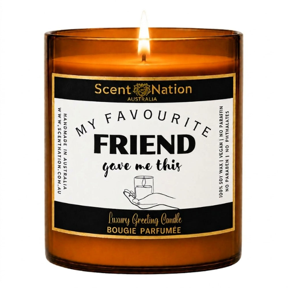 Best friend gifts: My Favourite Friend Gave Me This candle, Large 285g amber soy candle with a black and gold label and a hand holding a candle, Scent Nation Australia