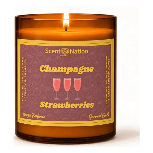 Scented candles Australia – Champagne & Strawberries soy candle in a Large 285g amber jar, a raspberry-red label with three pink champagne flutes and gold lettering