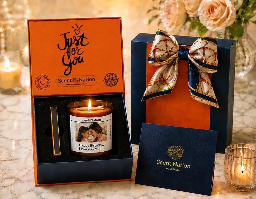 Personalised photo candle gift instead of a card – Scent Nation candle with a Happy Birthday, I love you Mum photo label in its orange Just for You gift box, beside the navy luxury gift box tied with a silk scarf