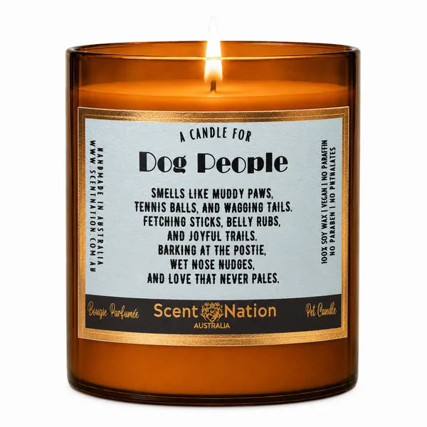 30th birthday gift for dog lovers – A Candle for Dog People, sky-blue label with gold border on a lit Large amber jar soy candle, Scent Nation Australia